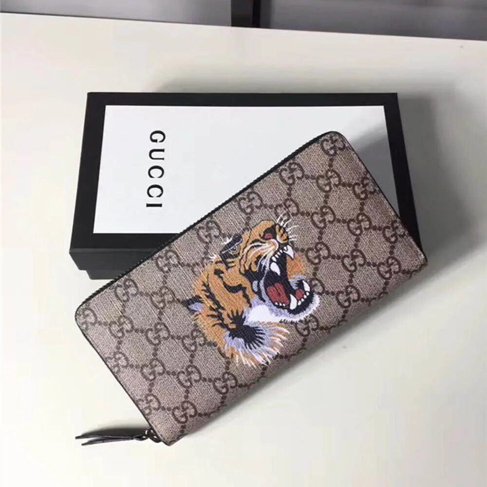 Gucci Tiger кошелек. Кошелек гуччи с тигром. Портмоне тигрового принта. Брендовый кошелек от гуччи.