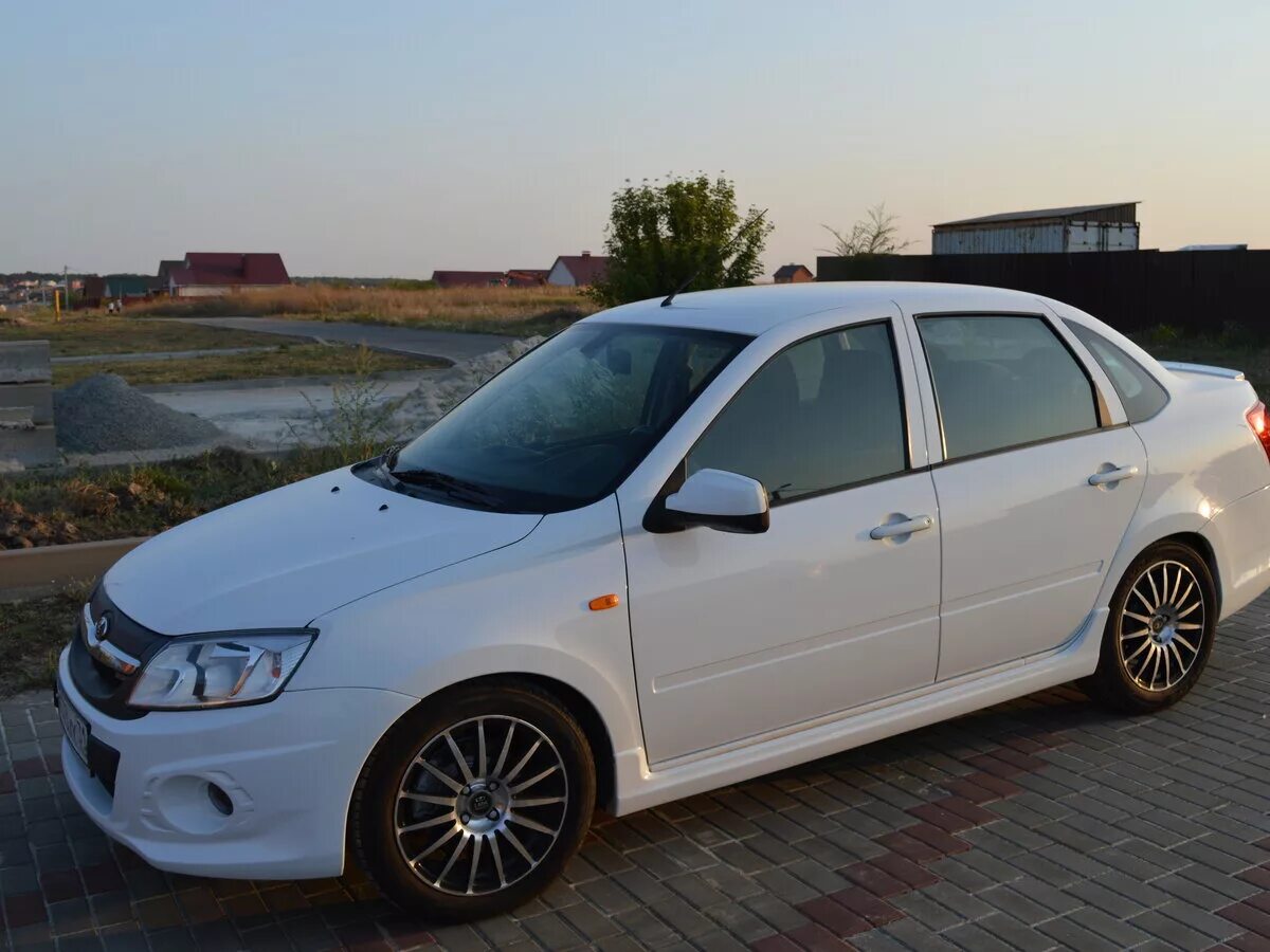 Гранта спорт 2014 черная. Белая гранта спорт 2014. Белая гранта спорт 2014. Лада гранта спорт 2014 года. Лада гранта спорт.