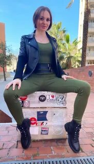 showing you her crotch on the street. public. outdoors. 