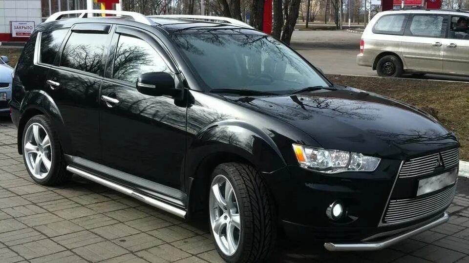 Мицубиси аутлендер хл 2010. Mitsubishi Outlander XL 2012 черный. Mitsubishi Outlander XL 2013. Mitsubishi Outlander XL 2008. Mitsubishi Outlander XL 2013 чёрный.