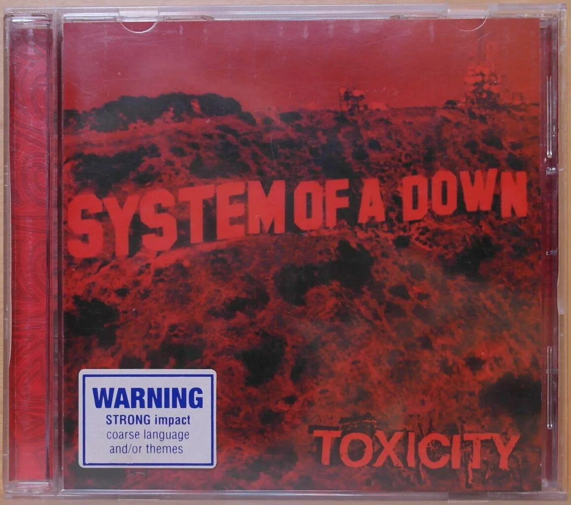 System of a down toxicity текст. System of down 2001 album. Toxicity обложка альбома. System of a down Toxicity альбом. System of a down альбомы.