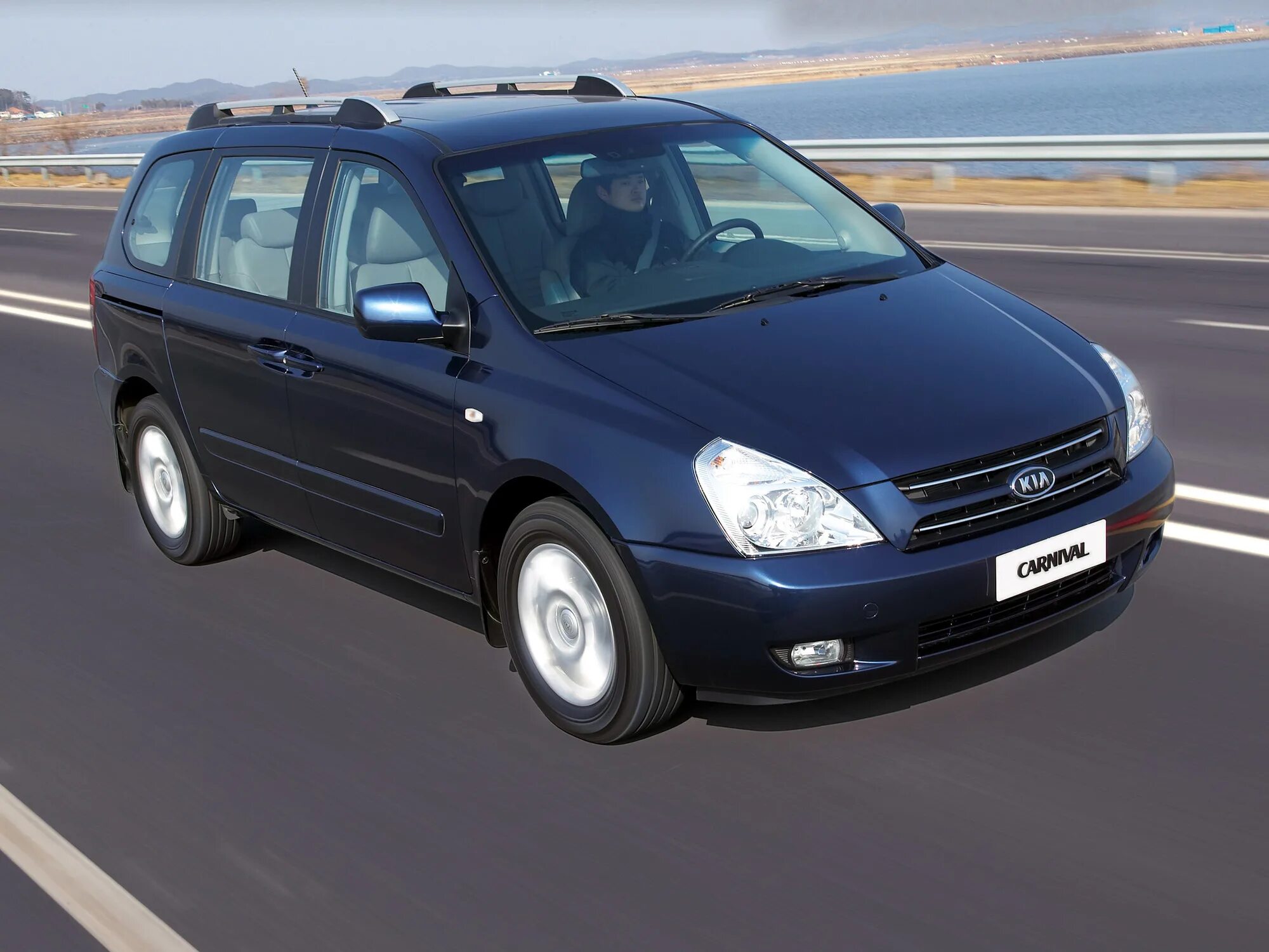 Kia carnival поколения. Kia Carnival 2006. Kia Carnival 2. Kia Carnival 2.2. Kia Carnival 2006 VQ.