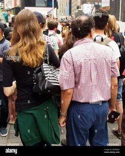 Man groping women in Times Square during Crushing One Ton of Ivory.