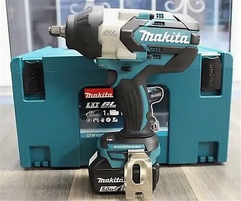 Makita dtw1002. Гайковерт Макита DTW 700. Макита гайковерт аккумуляторный ударный 18 в. Гайковерт Макита 18v. Makita dtw700z