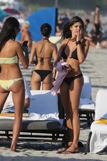 natalya alberto wearing a black bikini while she hang out on the beach in m...