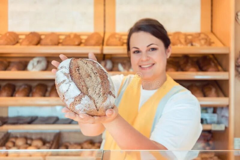 Charlie foster works at a bakery he. Bakery worker. women with bread. saleslady.