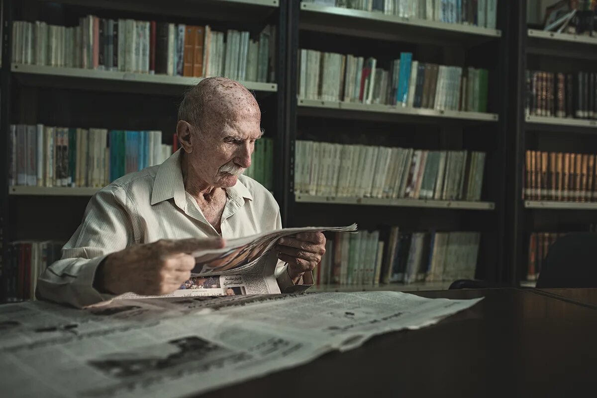 Tom started reading. Old man read book old library. man with book. man reading book. older man read book.