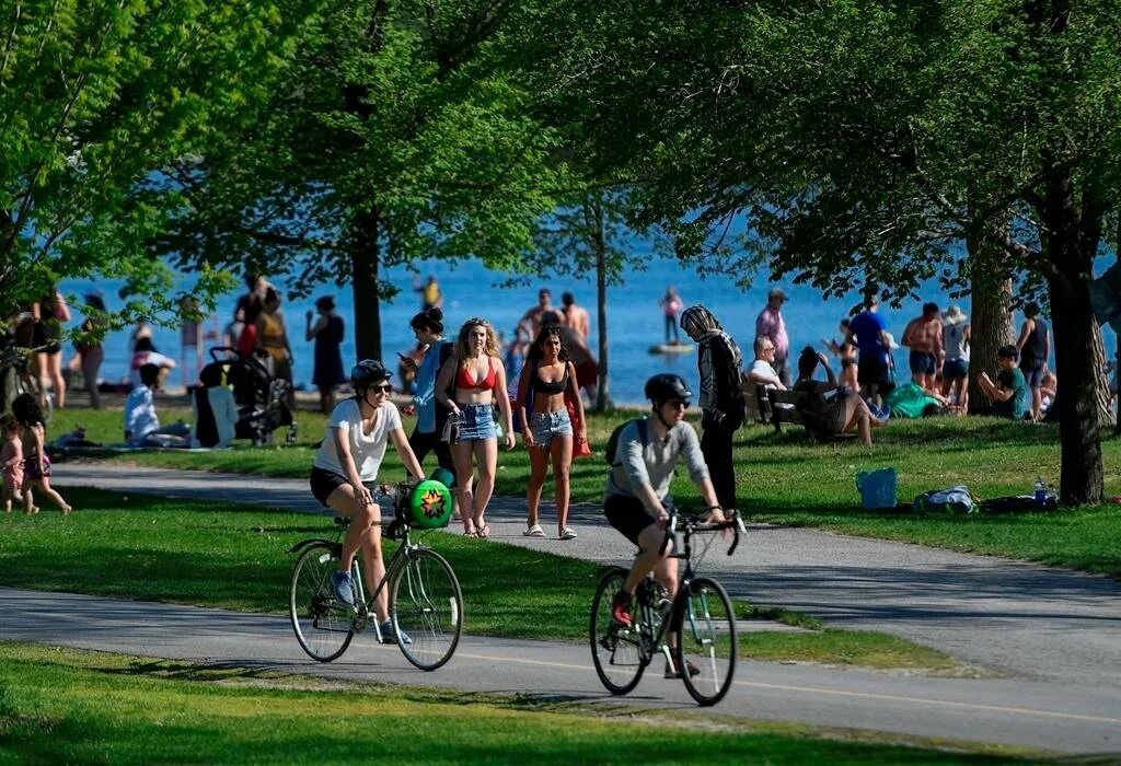 Enjoy the good weather. Warm weather. People enjoying the weather. Enjoy warm weather. Mooney's Bay Park.