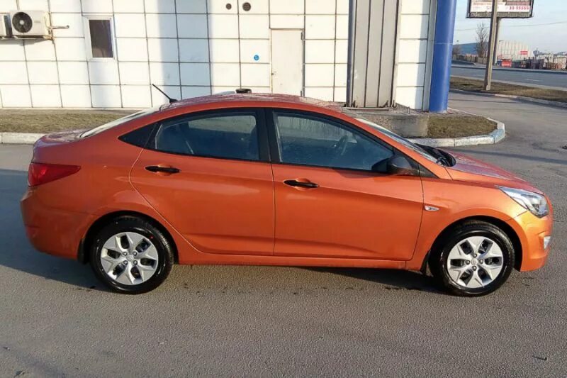 Солярис купить тула. Hyundai Solaris сбоку. Оранжевый Хендай Солярис 2011 года. Hyundai Solaris 2015 сбоку. Hyundai Solaris Side.