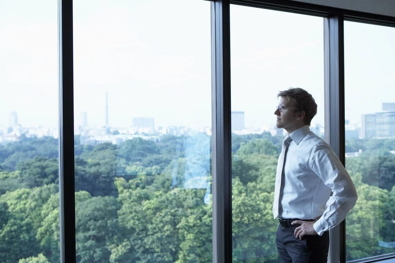 He stood at the window. Человек за окном the man from the window. look out of the window. окно пересвечено. man looking out the window.