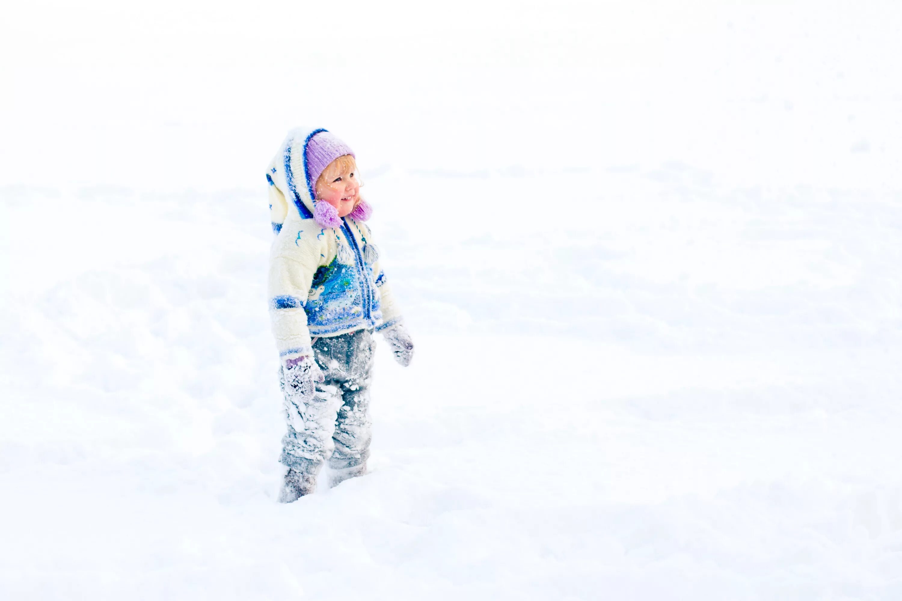 Child playing in the snow