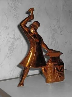 Часы с кузнецом