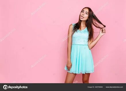 Download royalty-free Portrait of an attractive girl in a bright dress hold...