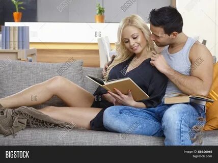 Download high-quality Young loving couple sitting on sofa, woman images, il...