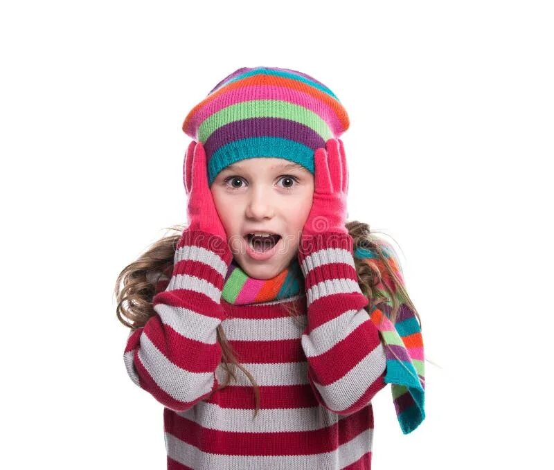 Девочка в шарфе показывает класс. A girl wearing a Scarf. Photo of a Kid in Scarf and hat with pompon Concept Happy childhood. She is wearing Scarf.