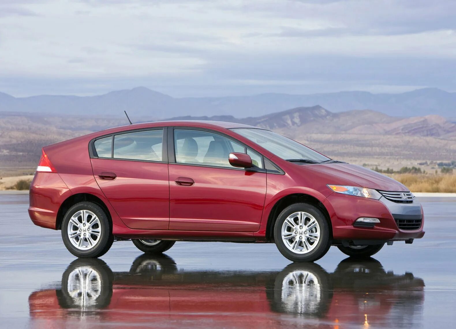 Инсайт 2010. Honda Insight 2010. Honda Insight 1.3 g 2010. Хонда Инсайт 2010 красная. Honda Insight 2009 красный.