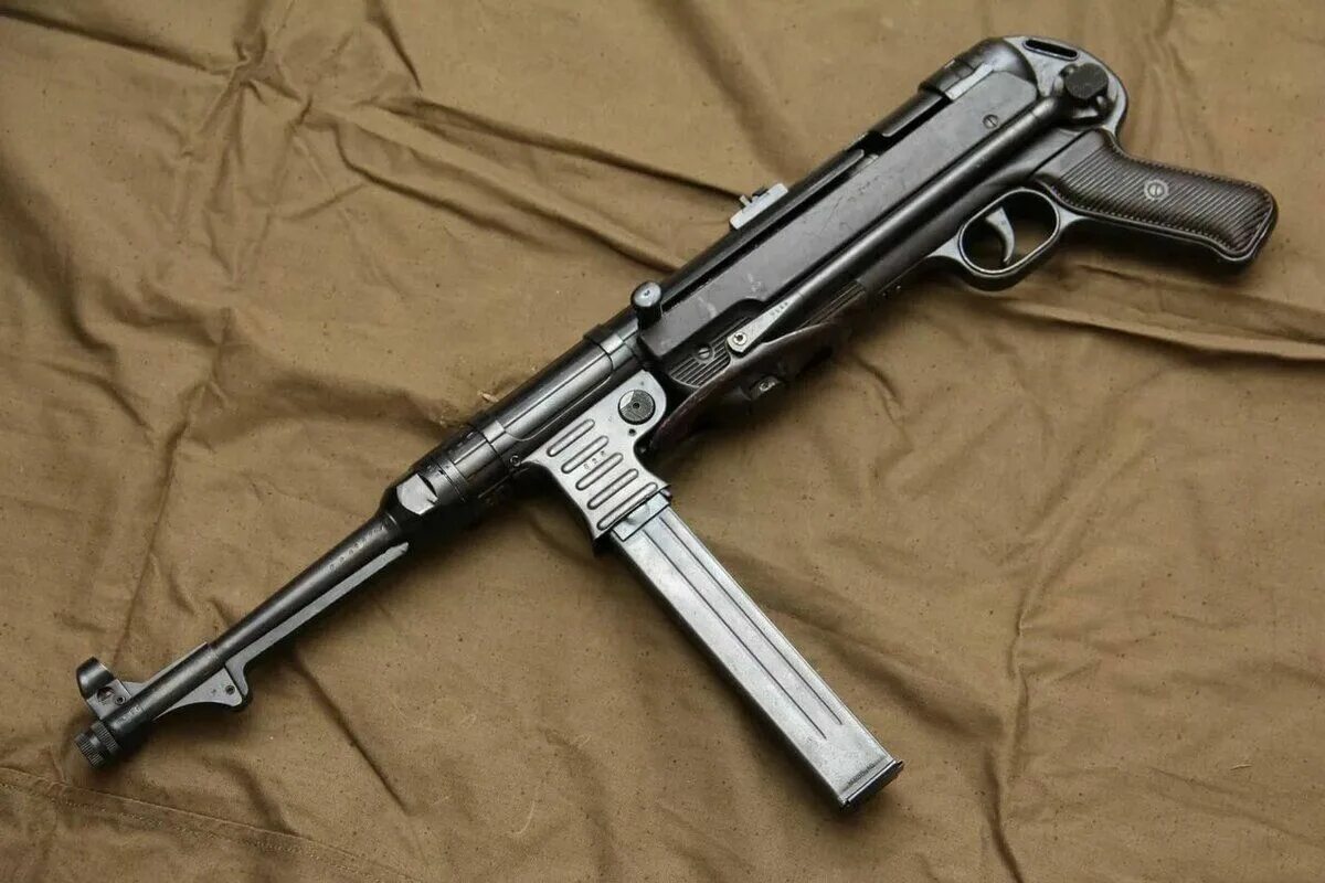 Мп-38-40. Мп-38-40. Автомат шмайсер. Немецкий автомат второй мировой мп40. Немецкий патроны для автоматы.