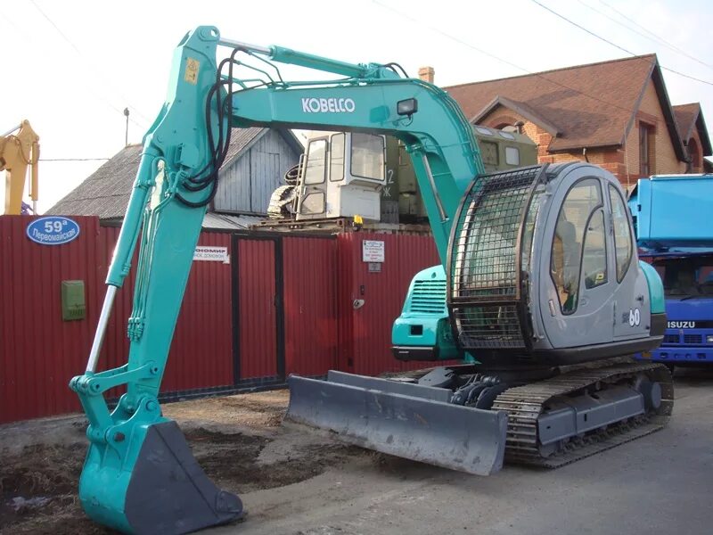 Экскаватор калуга. Kobelco sk60-3. Мини-экскаватор Kobelco sk60. Kobelco sk005. Экскаватор Kobelco sk200lc.