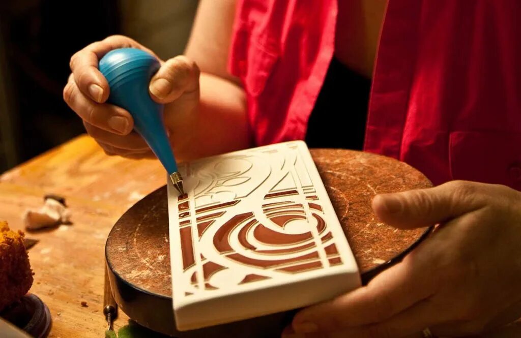 Make tile. Ceramic art. tile making art. restoration of ceramic artworks. ceramic is made of.