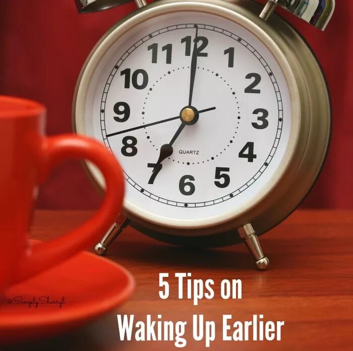 Premium Photo Red clock for business time on wooden desk.