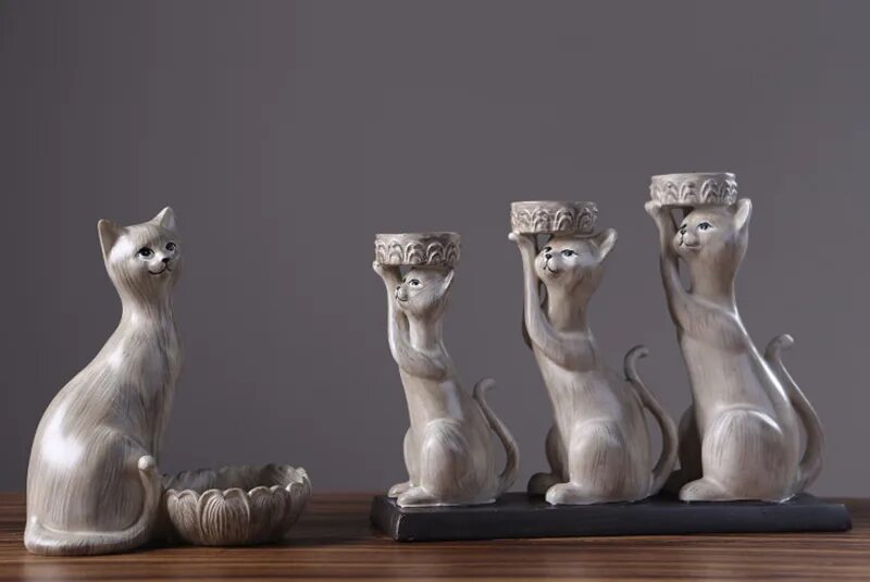 подсвечник котик с лапками. кошка со свечкой. подсвечник с животными. подсвечник с котиками камня. подсвечник с котами.