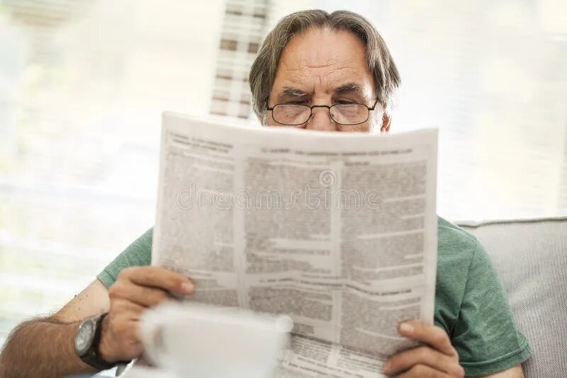 Most read newspapers. Человек с газетой. Most read newspapers. Newspaper famous. Man reading newspaper.