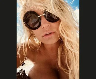 37. 4. Jessica Simpson strips off topless on the beach. 