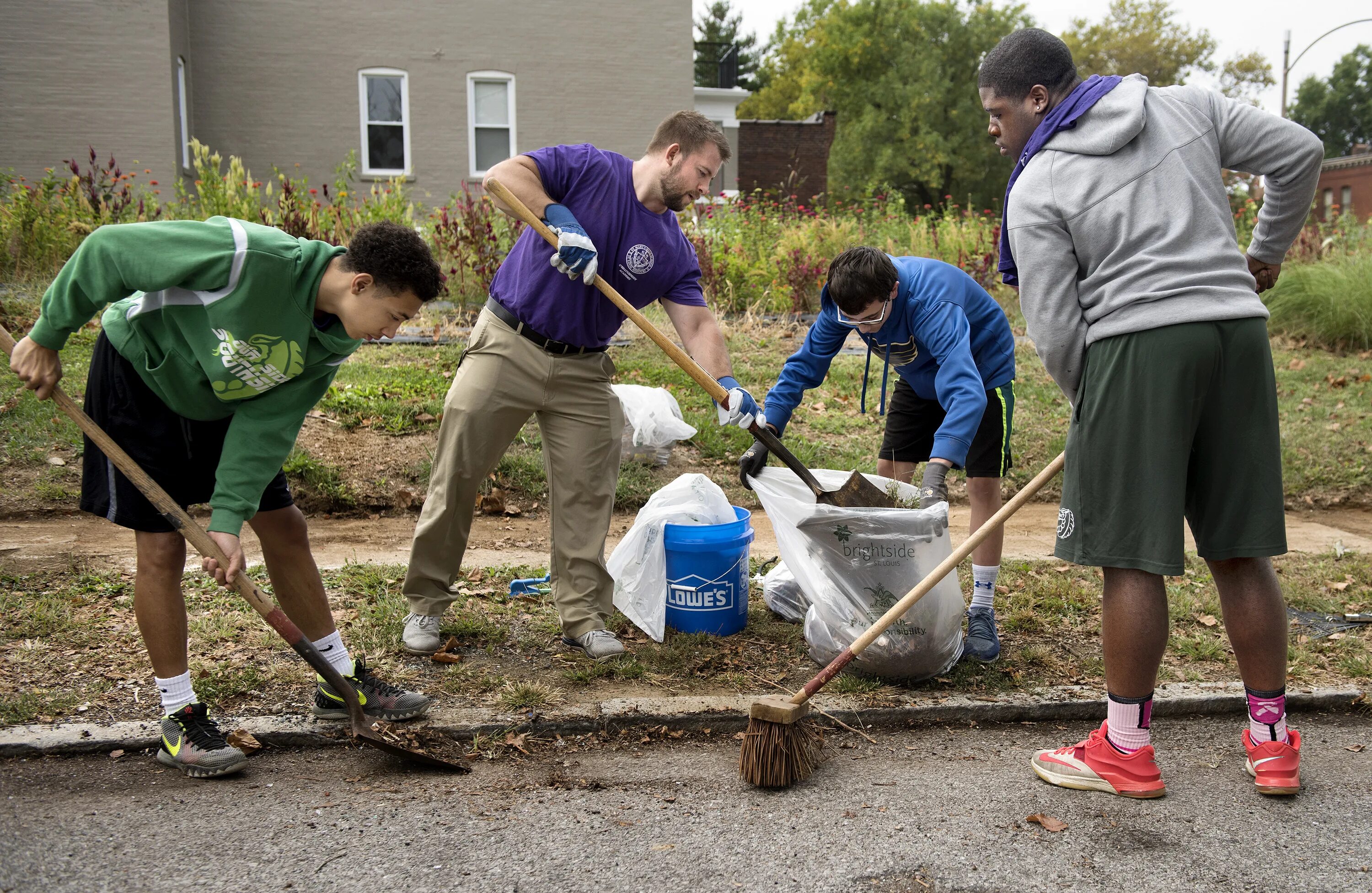 Clean up Day. People helping clean up Pond.