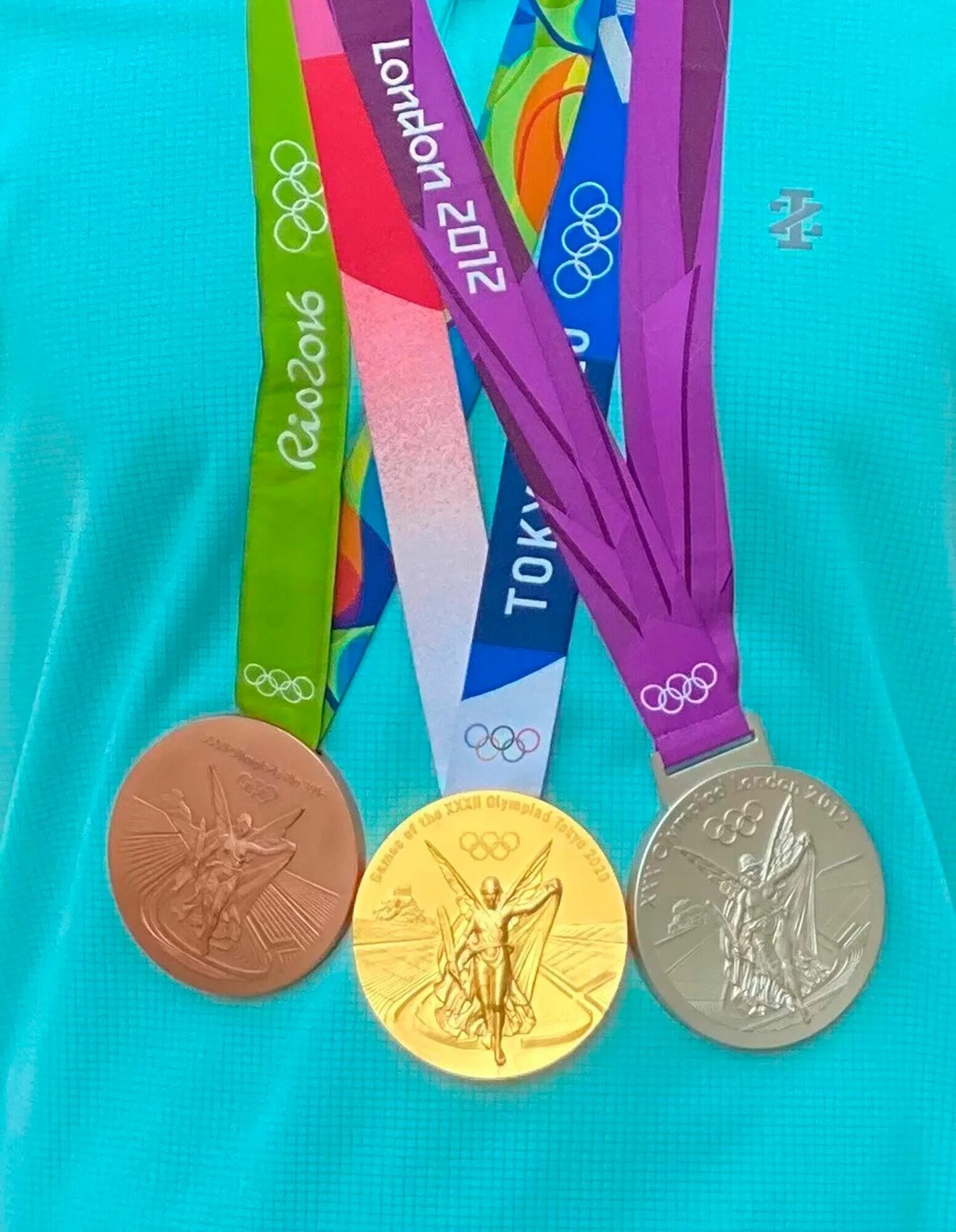 Olympic gold medal. Медали олимпиады. Three Olympic Medals. Медаль волейбол.