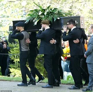 Pallbearers: Tom’s The Wanted friends were seen carrying the coffin in blac...