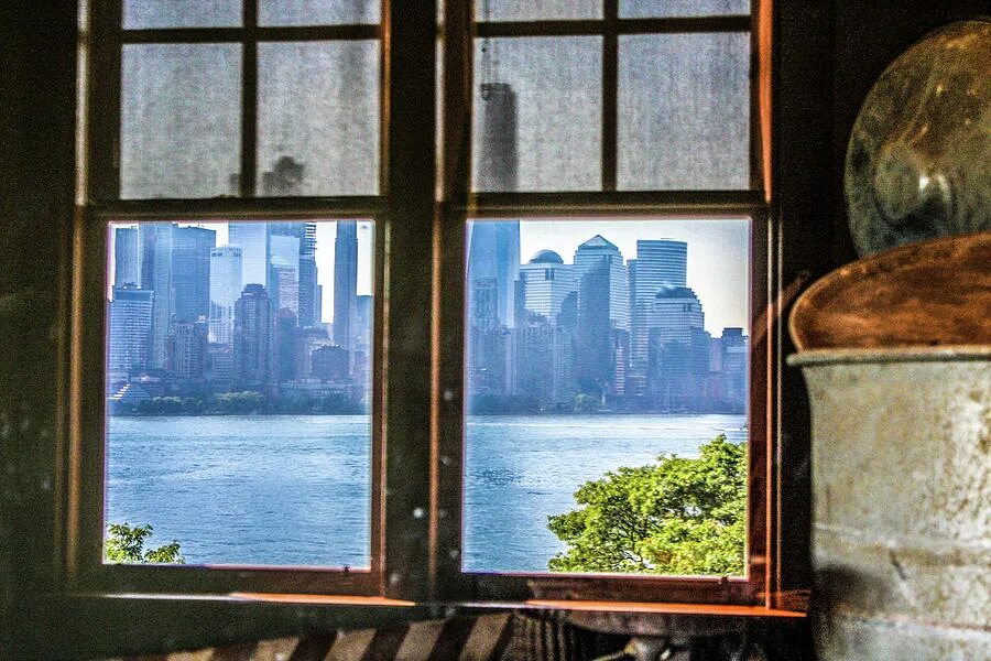 Sam is by the window. The main from the window. see window out. out of window or from the window. look out to the window.