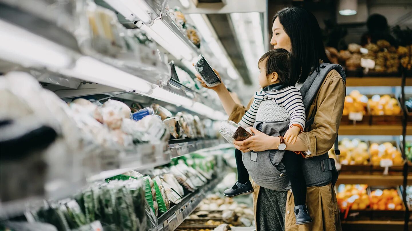 Market Date. Korean grandmother in grocery Store. A girl buying food from the Market. While market