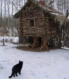 Дом на курьих ножках кошка на окошке