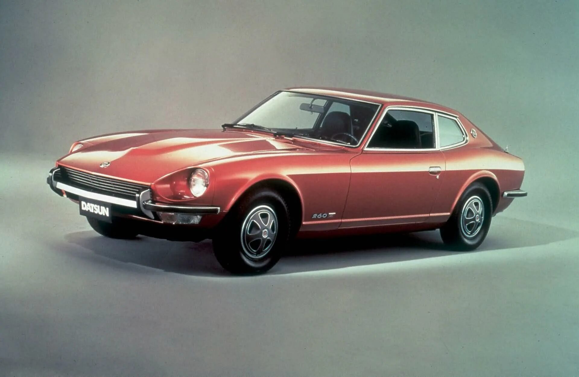 Первое поколение автомобилей. Nissan 260z. Ниссан Датсун 260z. Nissan Fairlady z 1969. Datsun 240z 1974.