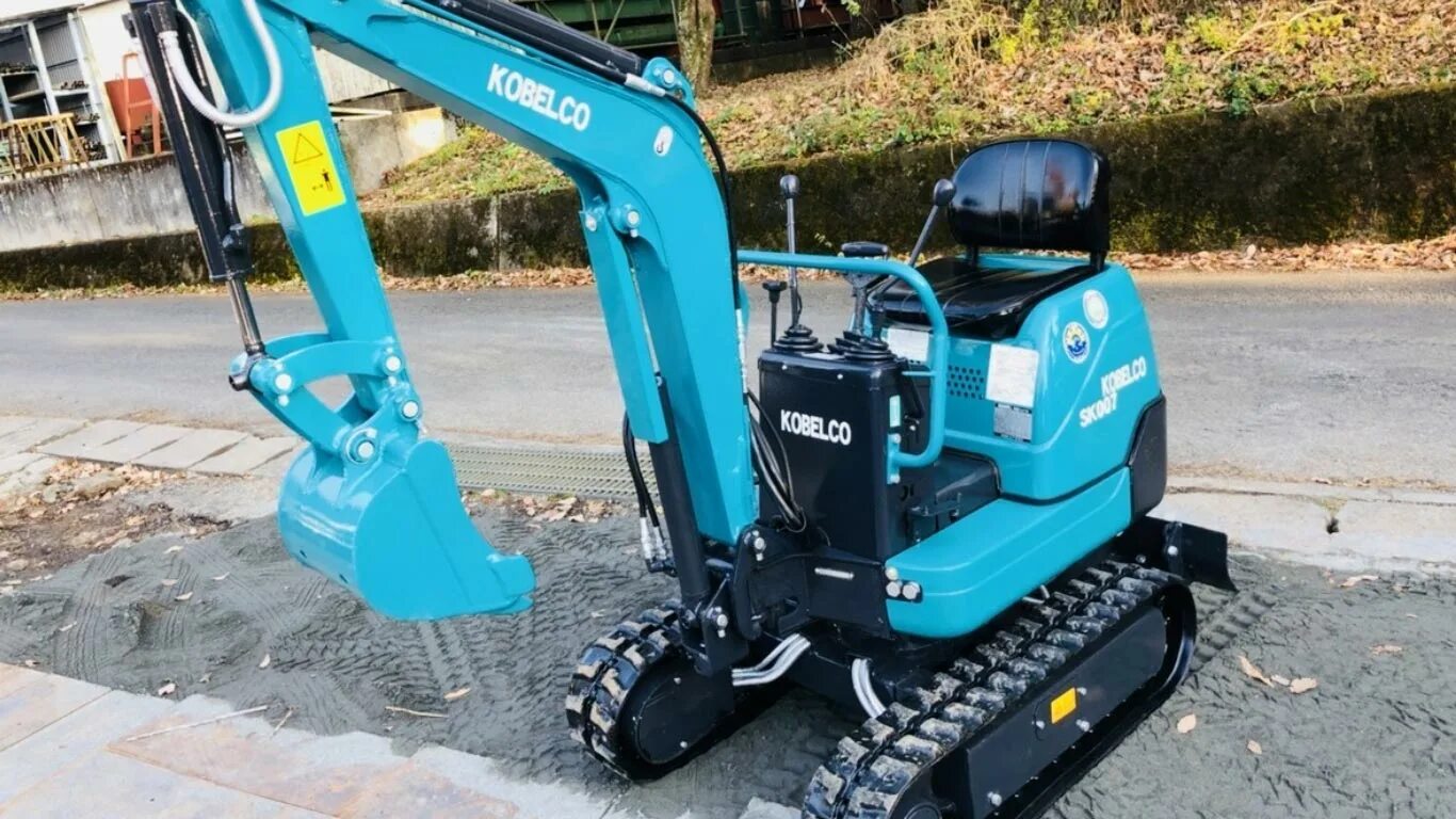 Мини экскаватор Kobelco sk007. Миниэкскаватор "Kobelco" sk007. Мини экскаватор Kobelco sk007 характеристики. Kobelco sk007 сваекрут. Купить японский экскаватор