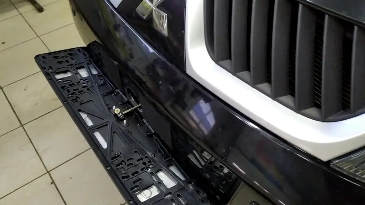 Откидные номерные рамки. Рамка номера под лебедку уаз патриот. Откидная рамка номерного знака для лебедки уаз патриот. Откидная рамка номерного знака вольво фш12. Рамка для номера автомобиля откидная.