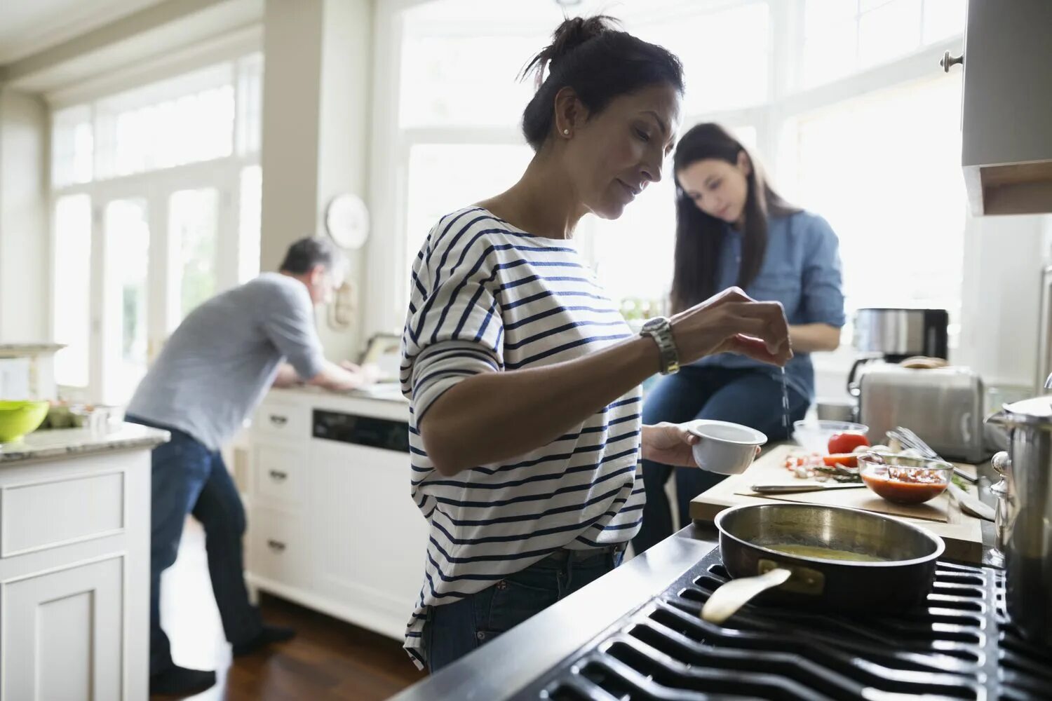 Cuisiner. Асханашы. A woman France Cooking. Beautiful couple preparing food.