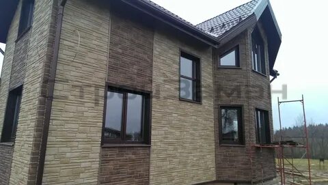 Фасадные панели под камень дома