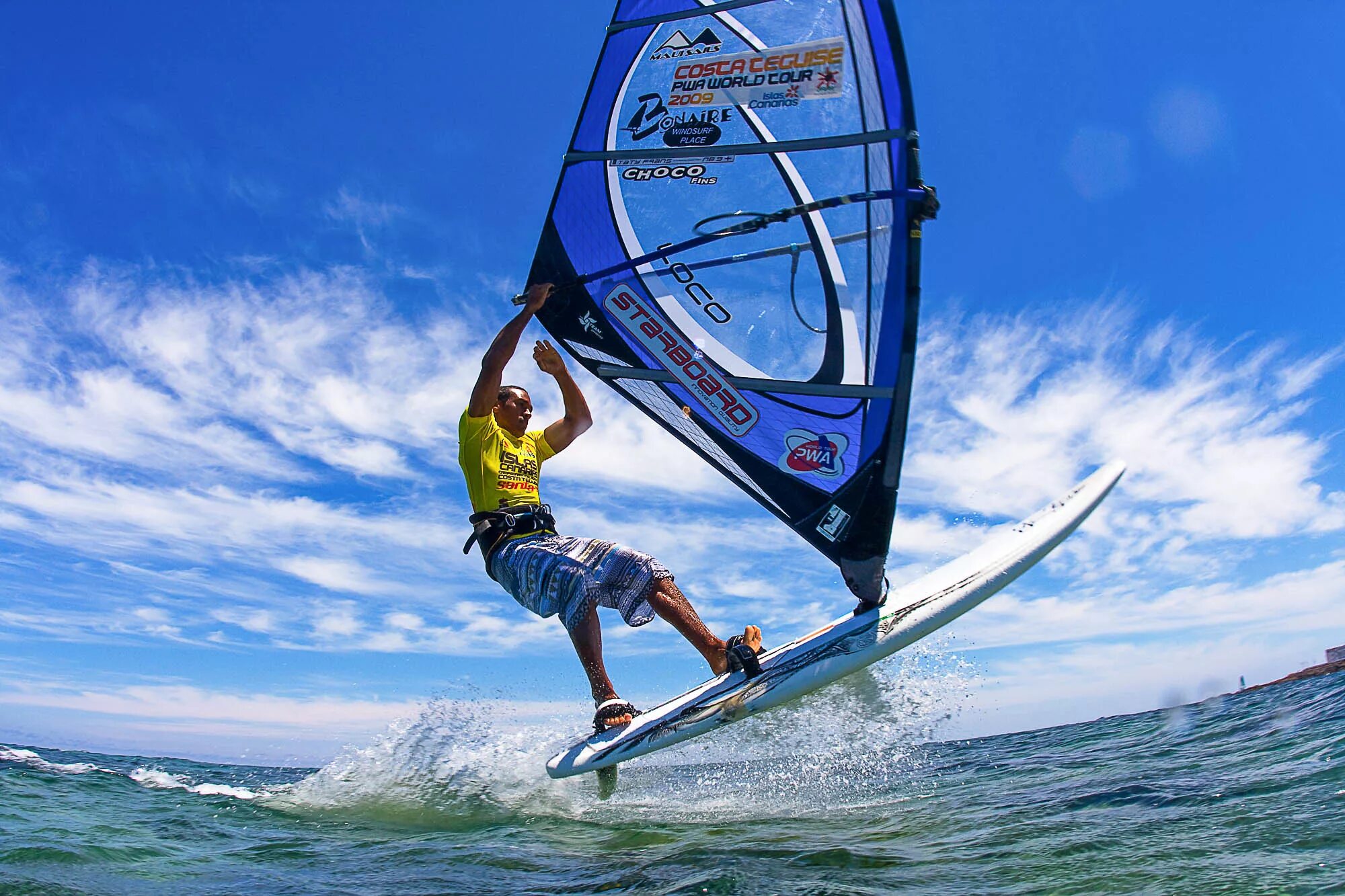 Complete the exchanges he is on windsurfing