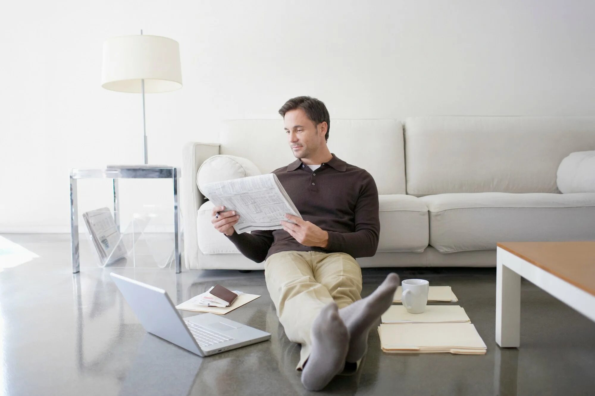 I was were reading a newspaper. Робот on the Couch and reading a newspaper. Бренд работодателя фото. Man reading newspaper. Leaning on.