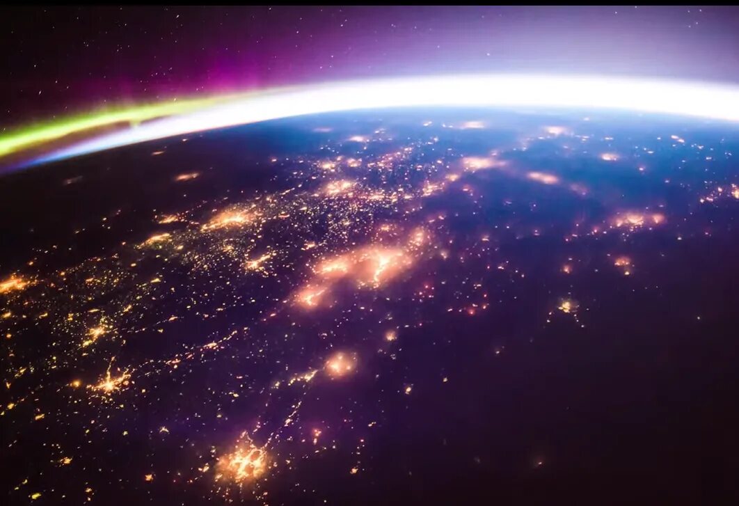 О земле и космосе. Снимок с космоса северное сияние мкс. Вид земли из космоса. Северное сияние с борта мкс. Как выглядит космос видео.