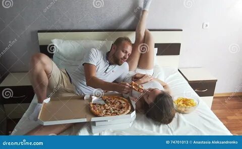 The Girl and the Guy Eating Pizza Lying on the Bed Stock Video - Video of l...