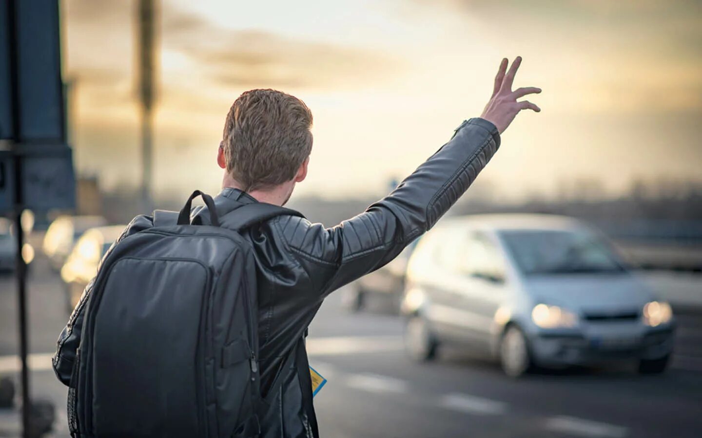 He took a taxi. Hail a Taxi. Tourist man. A man stopping a Taxi. Stop man.