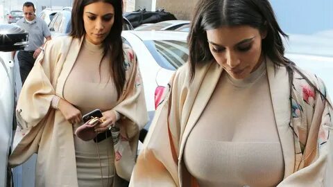 Kim Kardashian flashes mega cleavage in clinging nude outfit after revealin...