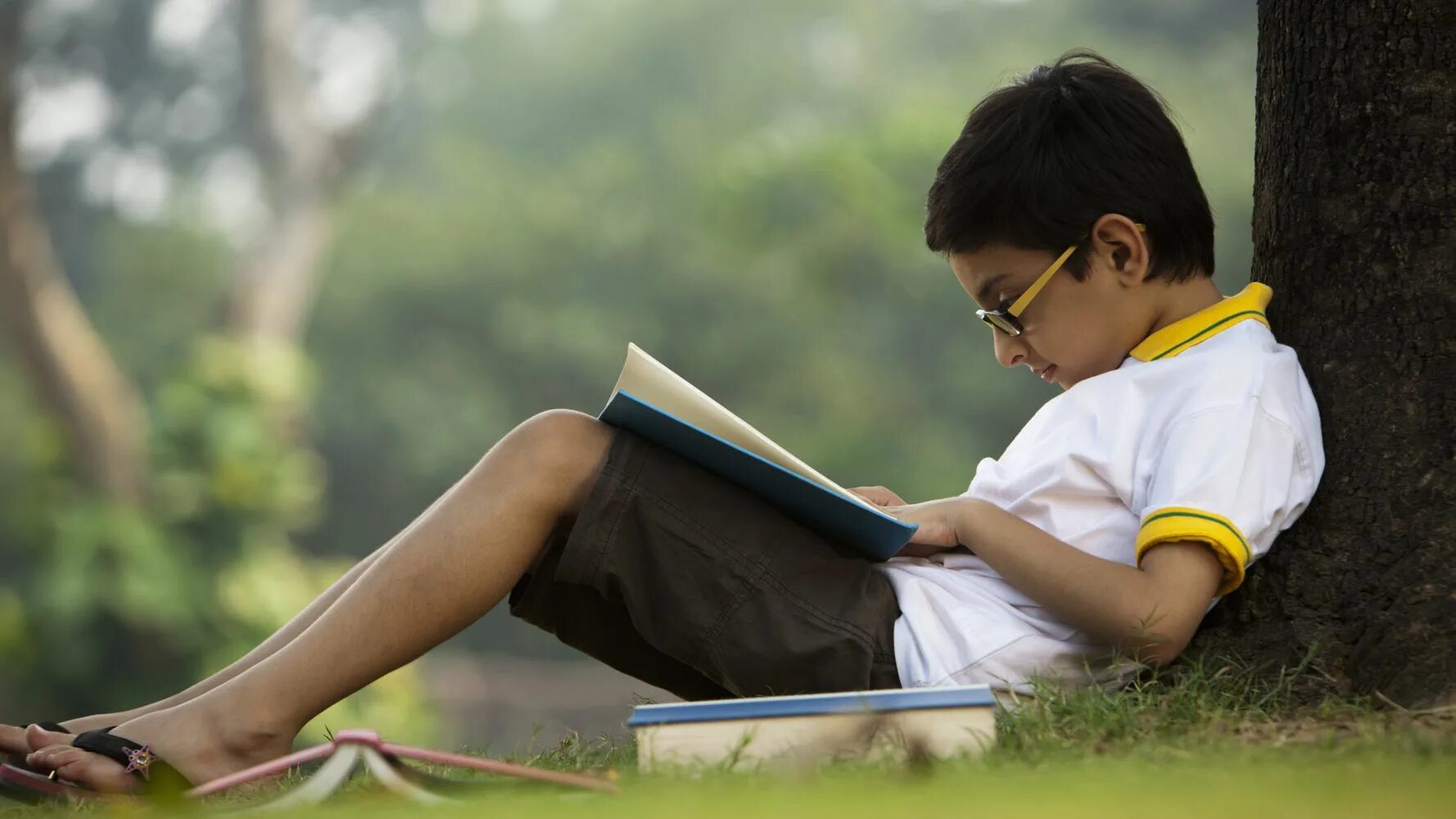 When i was a child i ask. Children read books. children who read books. the boy is reading a book. indian books.