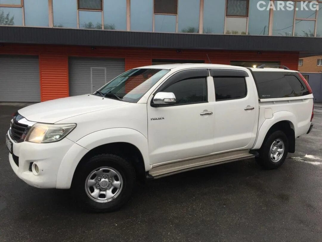 Тойота хайлюкс 2012 цена. Тойота Хайлюкс 2012. Toyota Hilux 2012 белый. Тойота Хайлюкс пикап 2012. Тойота Хайлюкс 2012 белбелый.