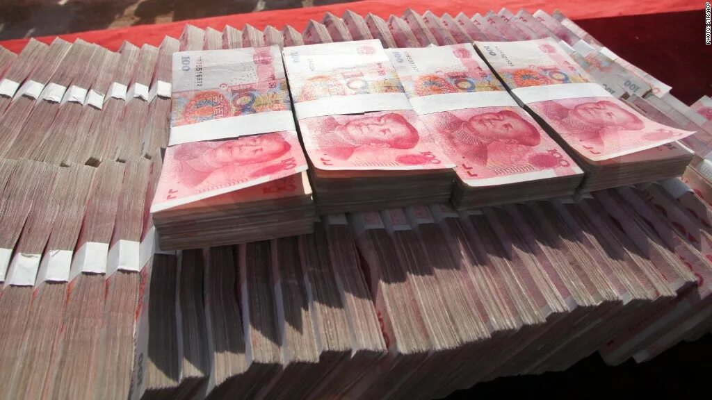 Миллион юаней в рублях 2024. Юань пачки. Пачка китайских денег. Пачка денег юани. Пачка денег Китая.
