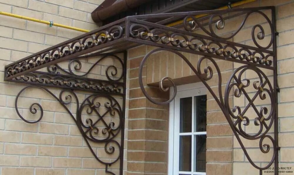 Кованые козырьки над крыльцом. Кованые навесы и козырьки. Кованые козырьки. Козырек ковка. Кованые навесы над крыльцом.