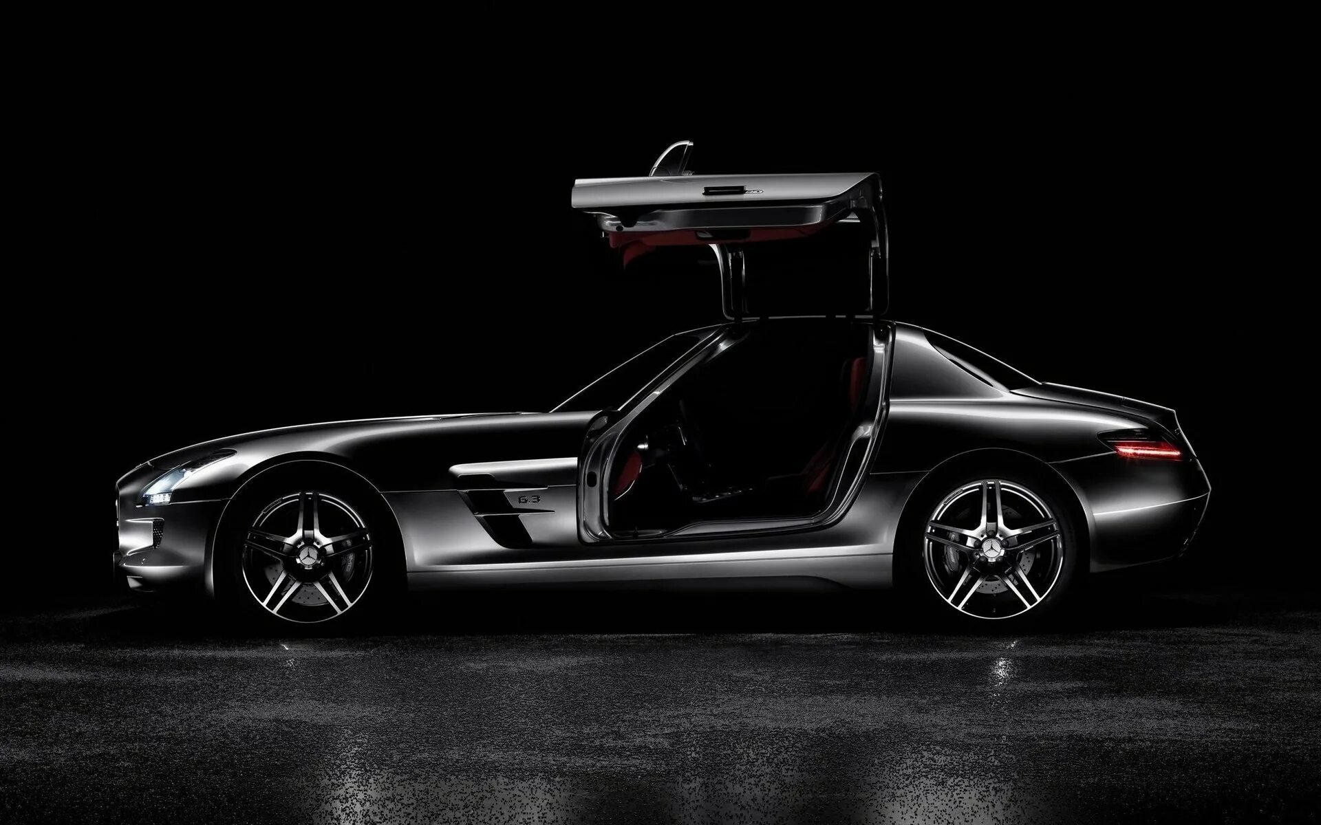 Мерседес на черном фоне. Mercedes Benz SLS AMG сбоку. Mercedes SLS AMG 2009. Mercedes Benz SLS AMG обои. Mercedes Benz SLS AMG 2022 вид сбоку.