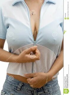 Photo about Body crop of busty woman with jeans unzipping her blouse - isol...